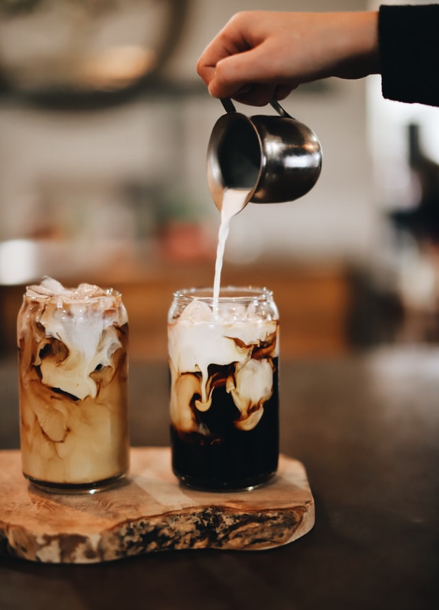Cup of aromatic coffee on wooden table